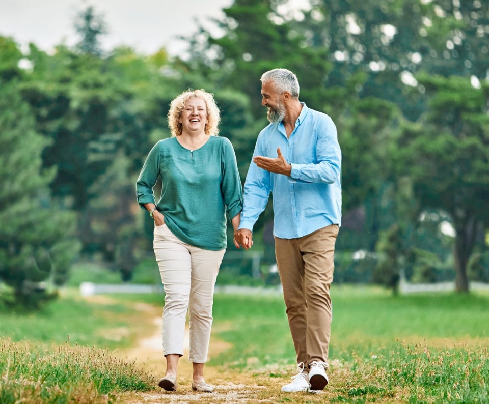 Couple smiling on a walk outdoors